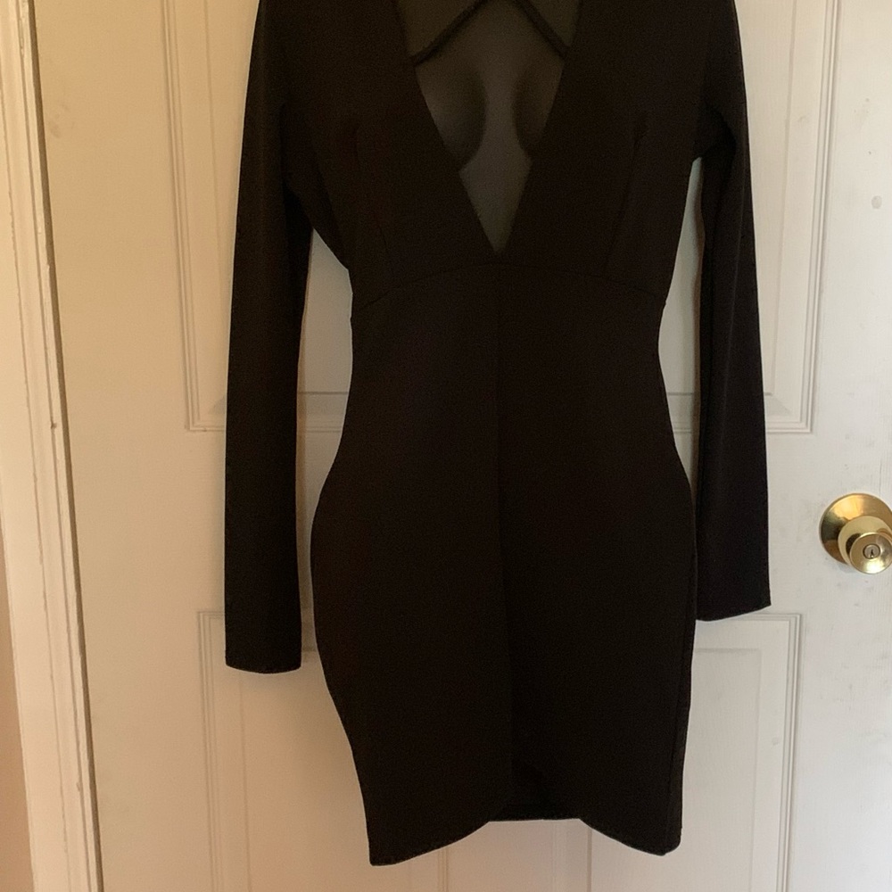 *Never Worn* Black dress. Long sleeve, low cut front